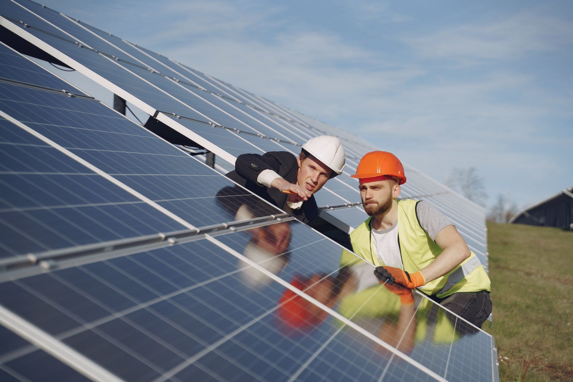 Solar engineers inspecting panels